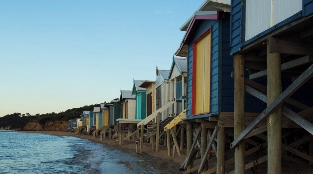 A big feature of the beaches that line the eastern shorelines of Port Phillip Bay in Victoria are the brightly coloured beach bathing boxes. Mount Martha has some spectacular examples of these curious structures, especially these where the stairs hang suspended over the water. And there is nothing like a sunset on the beach.