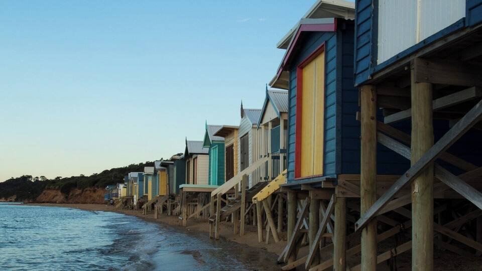 A big feature of the beaches that line the eastern shorelines of Port Phillip Bay in Victoria are the brightly coloured beach bathing boxes. Mount Martha has some spectacular examples of these curious structures, especially these where the stairs hang suspended over the water. And there is nothing like a sunset on the beach.