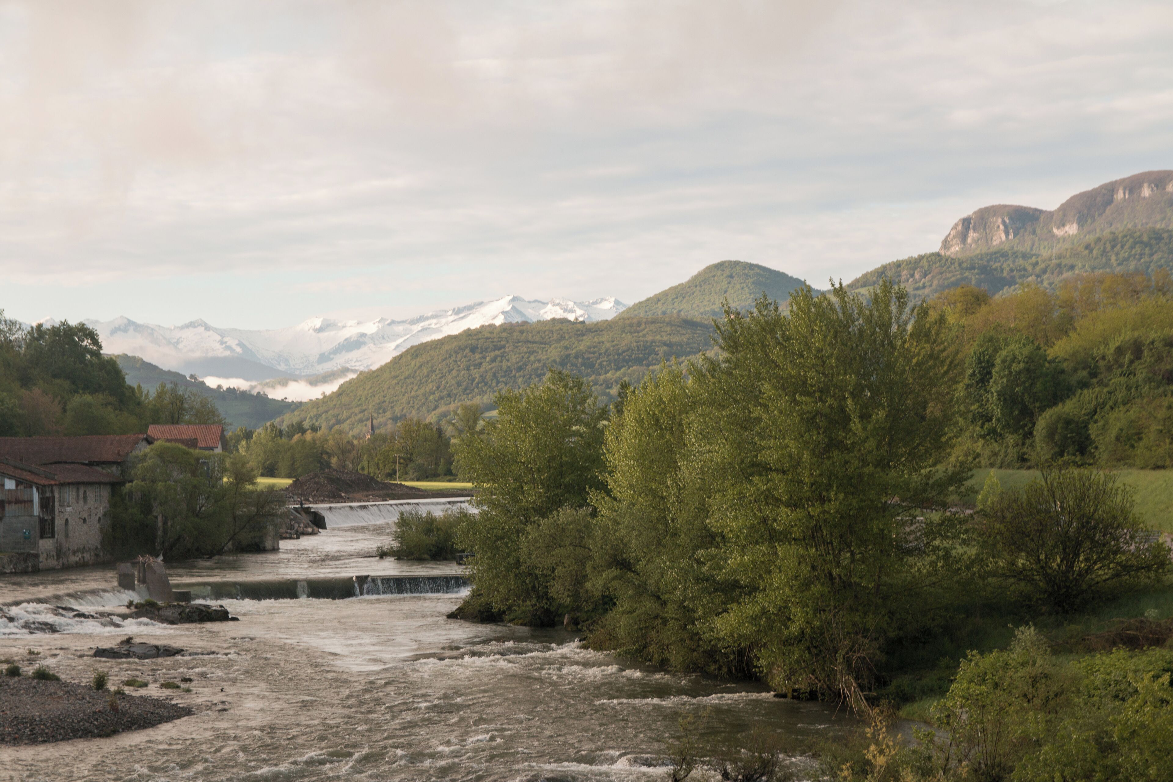 View, from the bridge over the Salat, on a few peaks of the Pyrenees of Ariège : Mount Valier ,Peak of Montau, Peak Soubirou.
