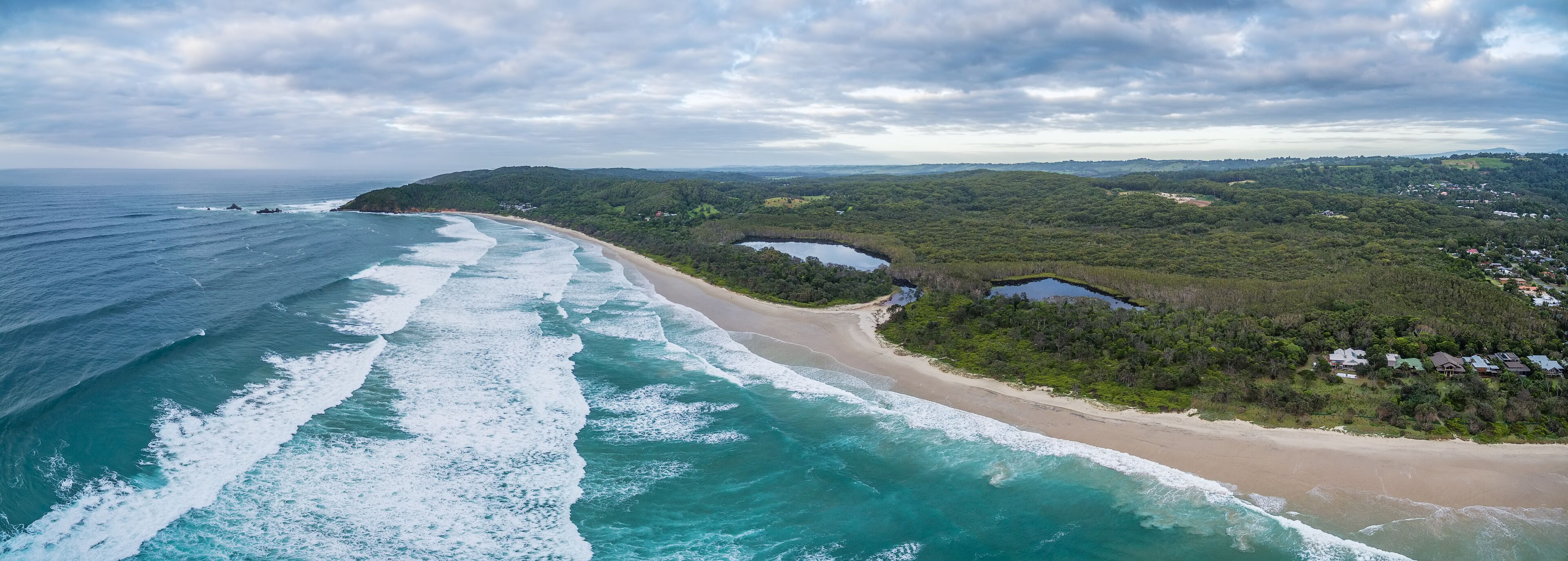 Aerial panorama of ocean coastline and coastal vegetation in New South Wales, Australia