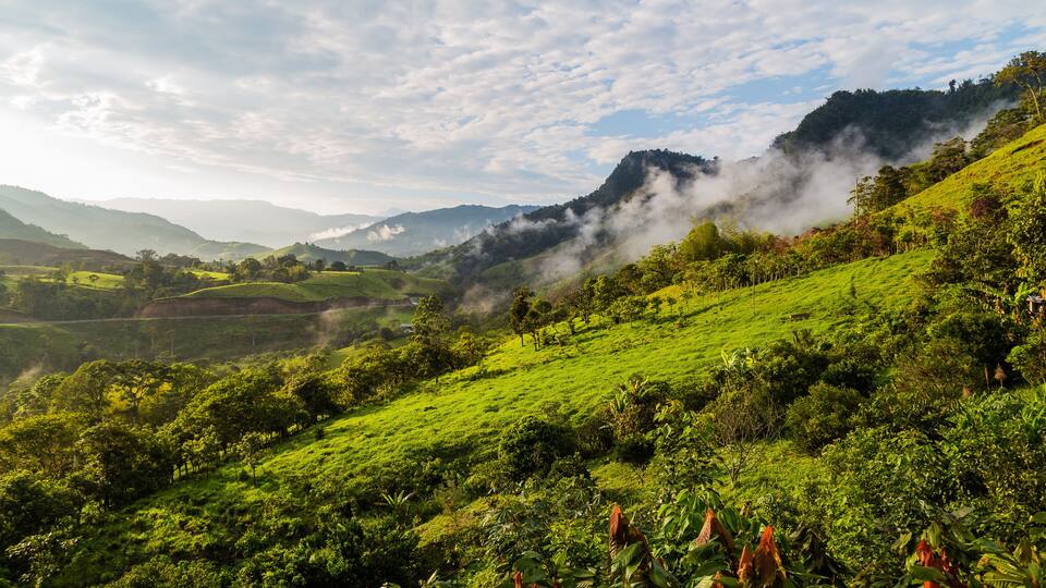 Landscape with clouds, jungles, mountains and crops Andes, Ecuador