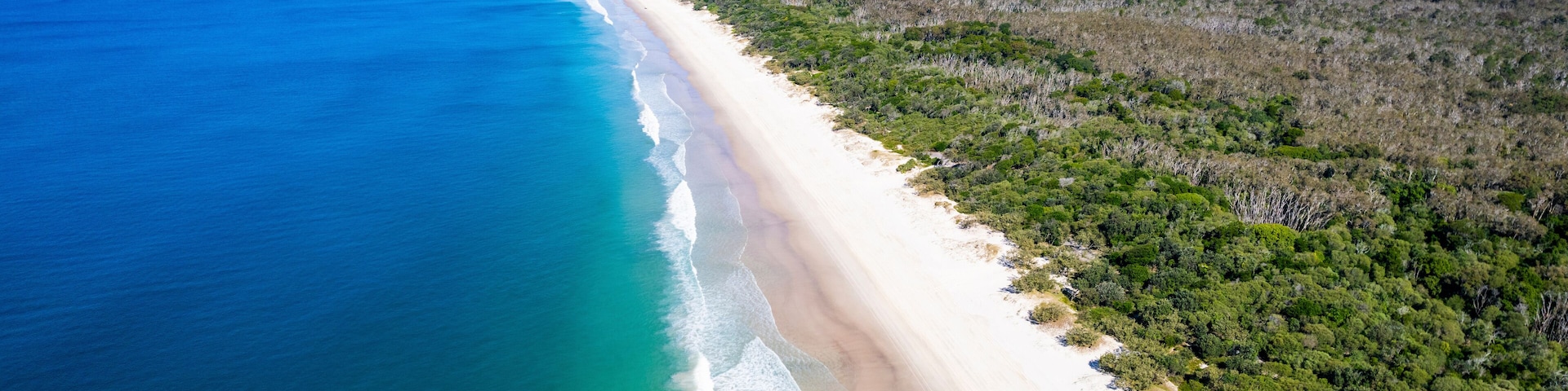Aerial view of Tropical Paradise Beach along Coral Sea, Bribie Island, Australia.