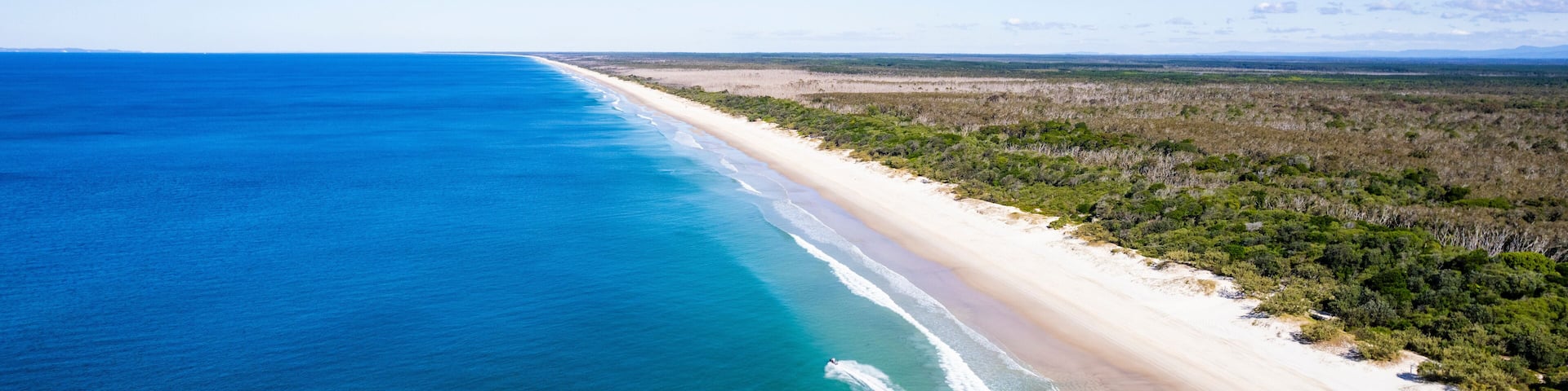 Aerial view of beautiful Ocean Beach with Jetski, Bribie Island, Queensland, Australia.