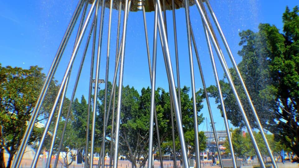 The world famous Cauldron that Cathy Freeman lit in the Sydney 2000 Olympic games. My kids are having a ball getting wet on a hot summer's day.