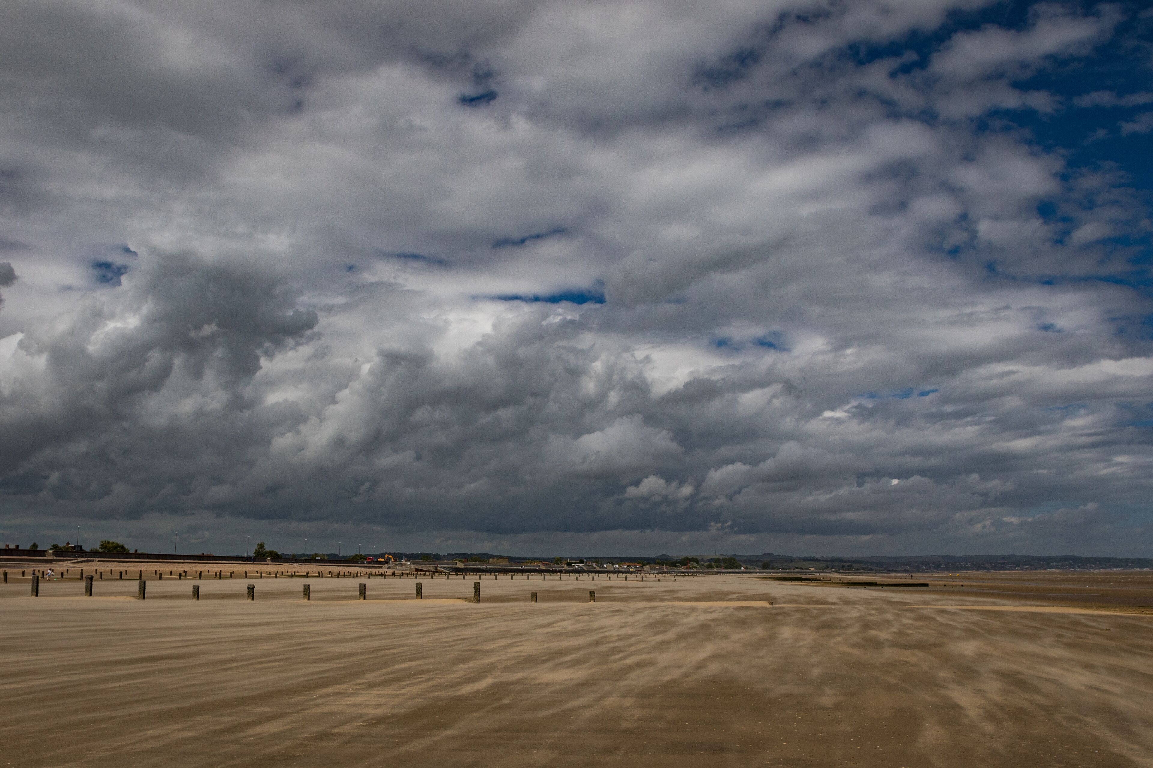 Rolling clouds over Dymchurch beach, Kent, England
