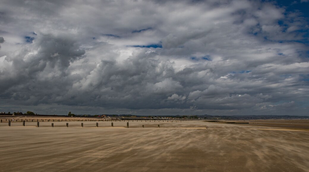 Rolling clouds over Dymchurch beach, Kent, England