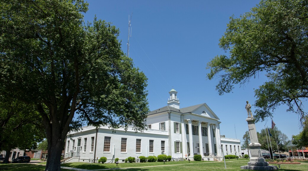 Tallulah, Louisiana, USA - April 23, 2024: Afternoon sun shines on the historic 1887 Madison Parish Courthouse of downtown Tallulah.