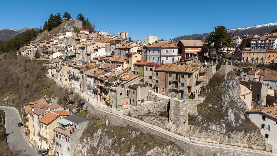 A hillside town with historic buildings and a prominent church.