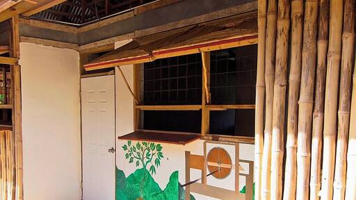 Although his bakery stand is new, Daniel Frederick still employs traditional techniques in crafting his delicious cassava bread. Fresh ground manioc is mixed with coconut, sugar and water to form a dense, flat bread similar to a thick pancake. The coconut and sugar add a touch of sweetness that makes this bread addictive.
The bakery is over in the Kalinago Territory on the east coast, so it's a bit of a trip if you're staying in Roseau. But if you're visiting the Kalinago Village it's worth a stop, and you can also hit it up on your way to/from the airport. I'm not sure that I pinned it just right, but any of the locals could quickly point it out.