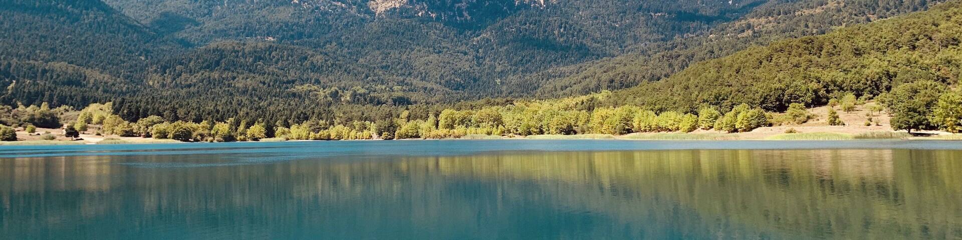 Beautiful lake surrounded by mountains in Korinthos, Greece taken on our last visit to Greece in September 2019
