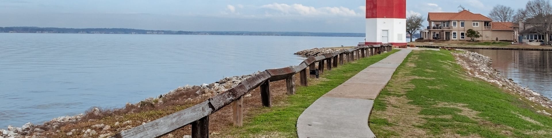 Lighthouse on Lake Conroe with clouds in background
