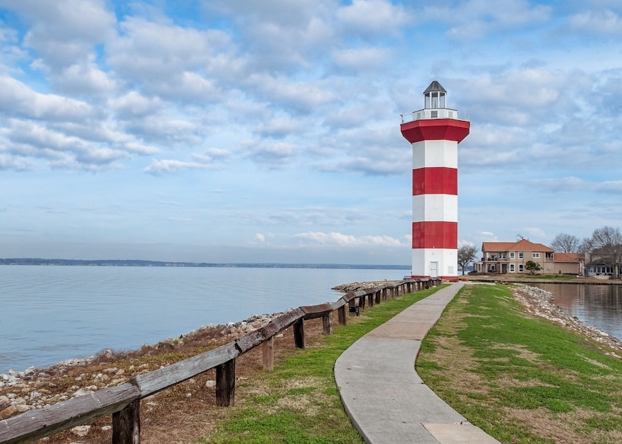 Lighthouse on Lake Conroe with clouds in background