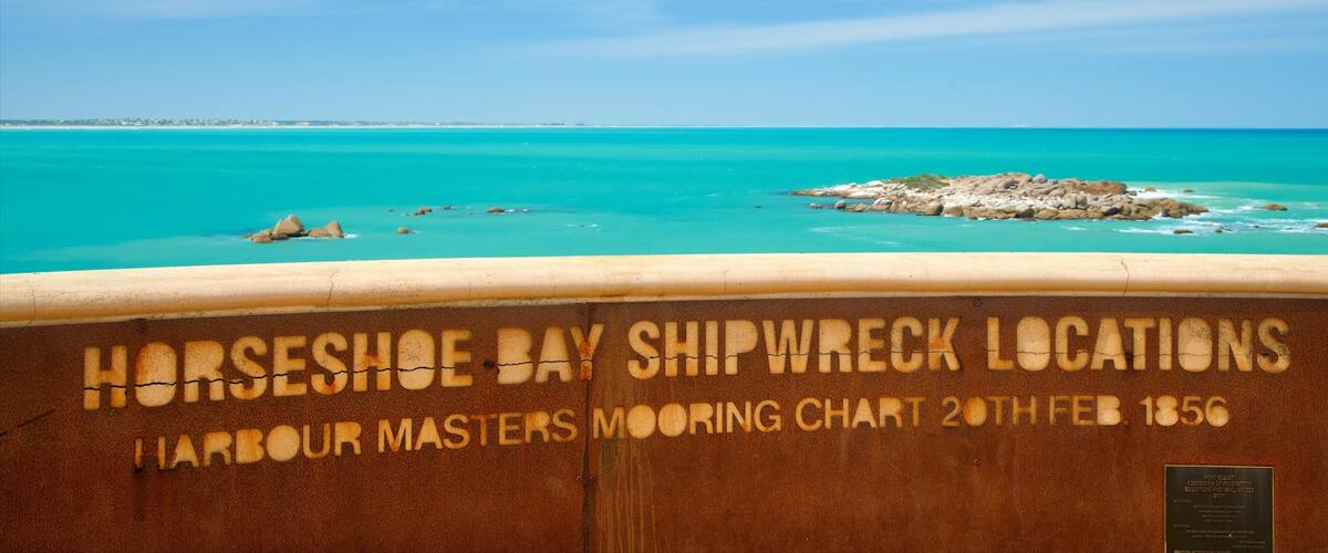 A shipwreck chart at Horseshoe Bay with turquoise waters and rocky outcrops.