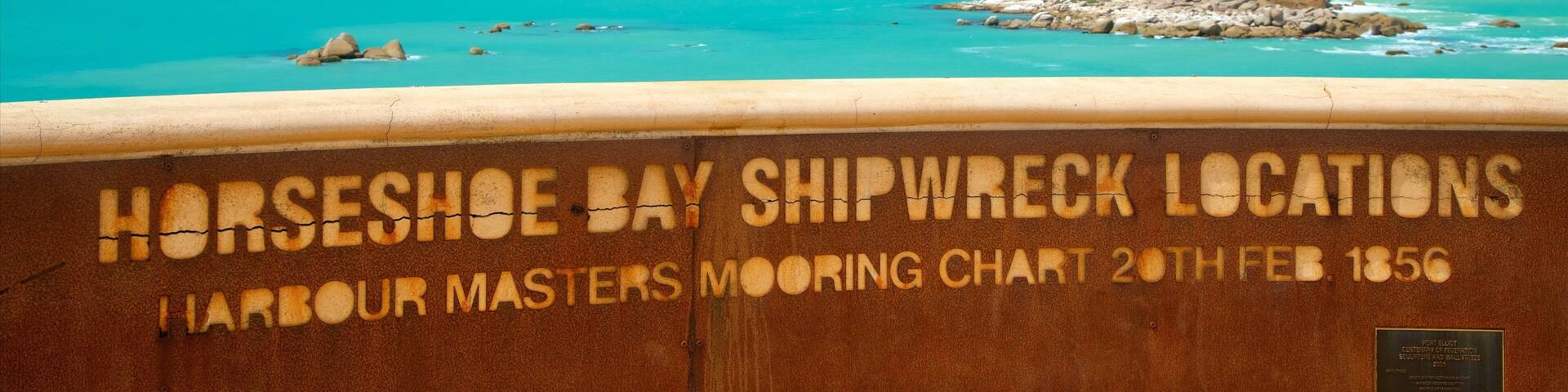 A shipwreck chart at Horseshoe Bay with turquoise waters and rocky outcrops.