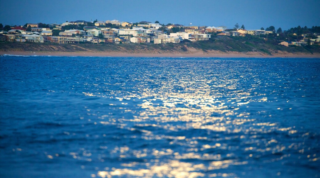 Victor Harbor showing waves, night scenes and a beach