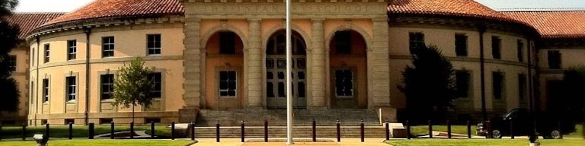 Fort Benning's first mission was to provide basic training for units participating in World War I. With the end of that war, Benning was closed until the Army could find another use. The first tenant unit was the Infantry School, which General George Marshall commanded beginning in 1934. The Infantry School is still located at Fort Benning, as are the wooden permanent buildings completed by the Civilian Conservation Corps in the 1930's.