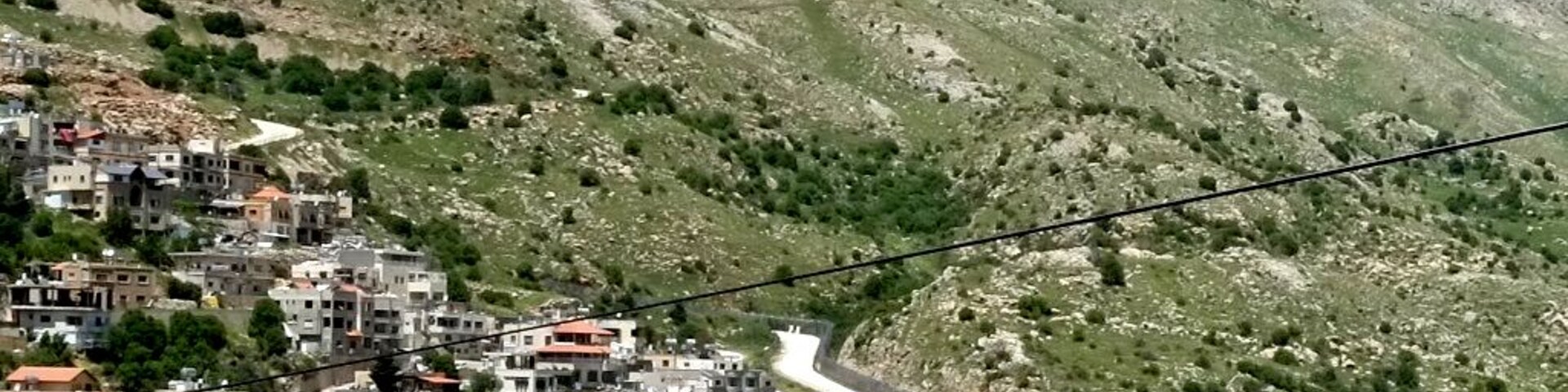 Majdal Shams is a small village huddled against the slopes of Mount Hermon, situated astride the ceasefire line between Israel's Golan Heights and Syria, Israel's sole ski slopes are situated above, lending the village a uniquely alpine atmosphere.
Almost all of Majdal's 9,000 residents adhere to the relatively obscure and secretive offshoot of Islam known as Druze; persecuted over the centuries, they sought refuge in the mountains.