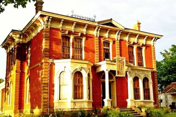 One of the oldest mansions in Walla Walla, this house was built around 1880 and now serves as a museum depicting daily Victorian life on the frontier.
From the website:
When built, the Kirkman’s home was one of the grandest residences in Walla Walla reflecting tastes of the day and wealth generated by the ranching business. Now the Victorian Italianate house remains the only example of its kind locally, though vestiges of early 20th century architecture can be found throughout Walla Walla.
In its heyday, the house was the setting for lavish entertaining, as well as for routine activities of daily American Victorian life. In addition to being home for the Kirkman’s, it also served as a boys’ dormitory for Whitman College from 1920-1924. During this time Walter Brattain, 1956 Nobel Prize winner for the co-invention of the transistor, studied in the home. The house was elected to the National Historic Register in December of 1974 and has been run as a non-profit organization since 1981.