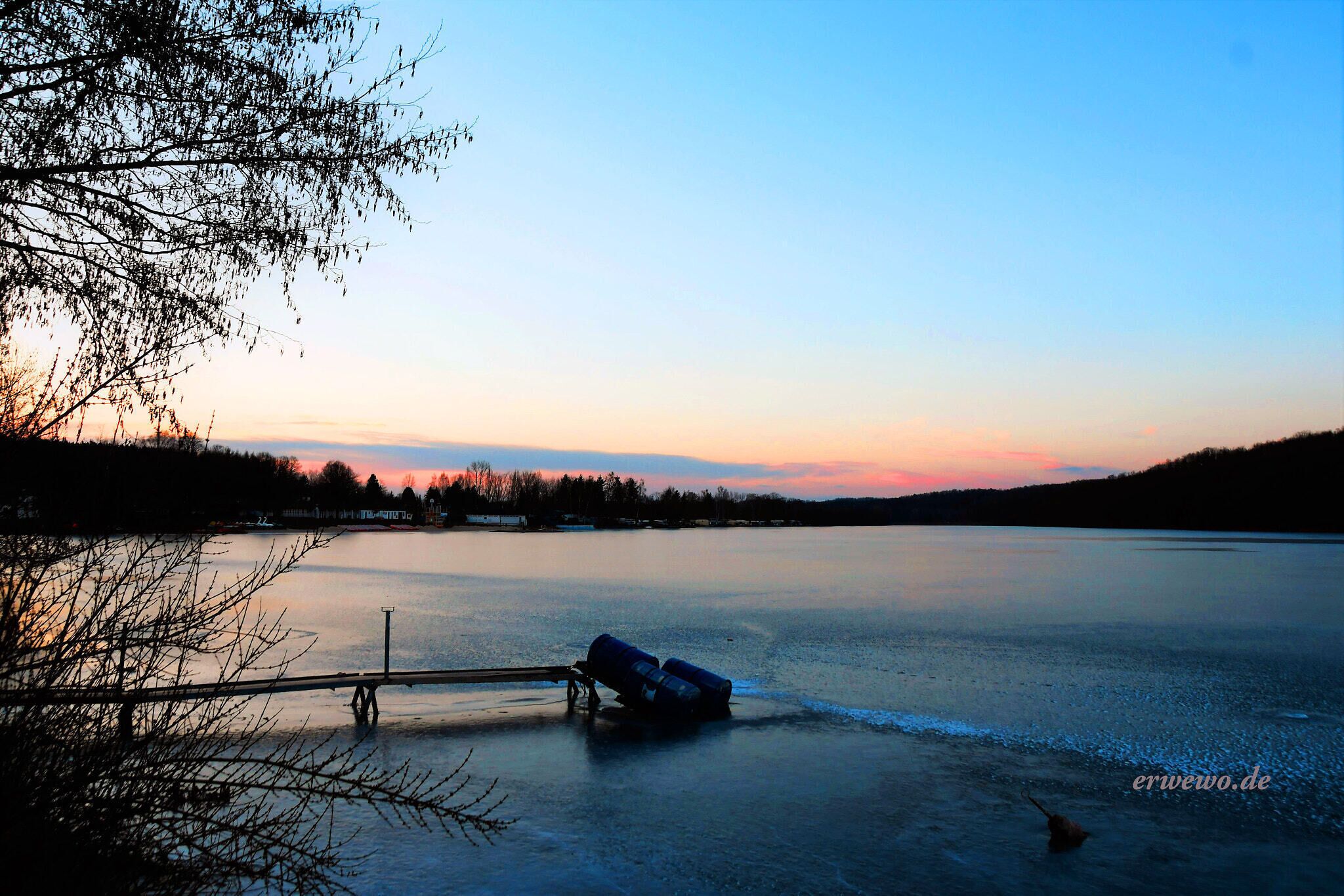 500px provided description: Abendstimmung [#sky ,#lake ,#frozen ,#sunset ,#water ,#reflection ,#river ,#colors ,#evening ,#pier ,#dusk ,#riverbank ,#jetty ,#moored ,#standing water ,#recreational boat ,#Koberbachtalsperre]
