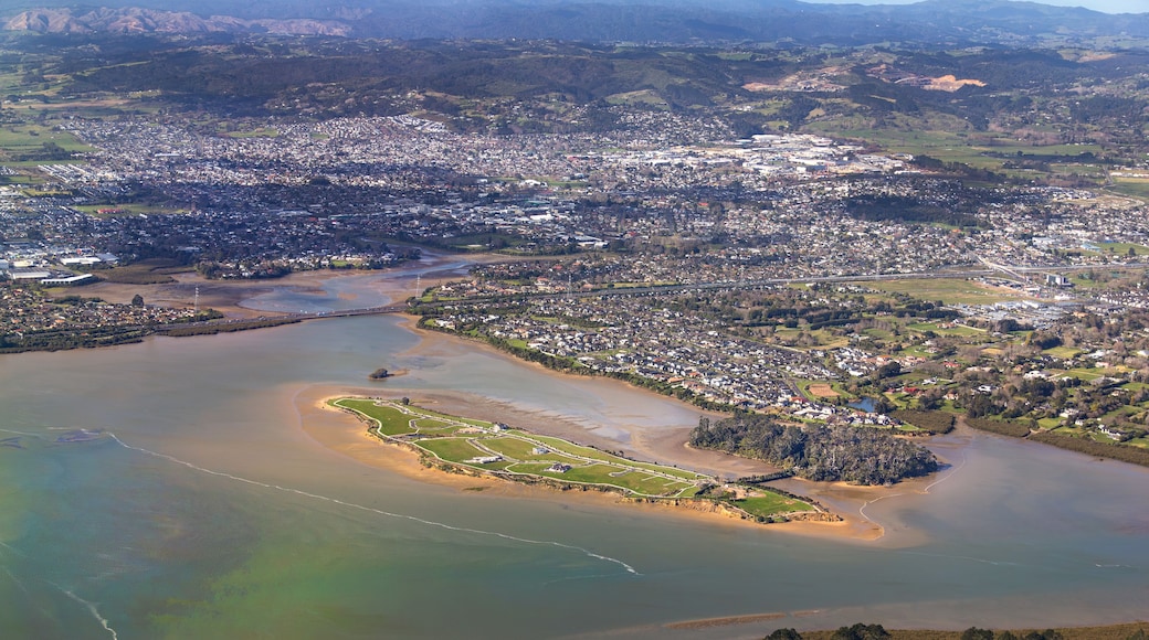 Pararekau Island and Manukau Harbour, Auckland, New Zealand, aerial view. Development in 2025 of gated exclusive subdivision on the island. Motorway, Karaka, Papakura, Takanini and Ardmore in distance