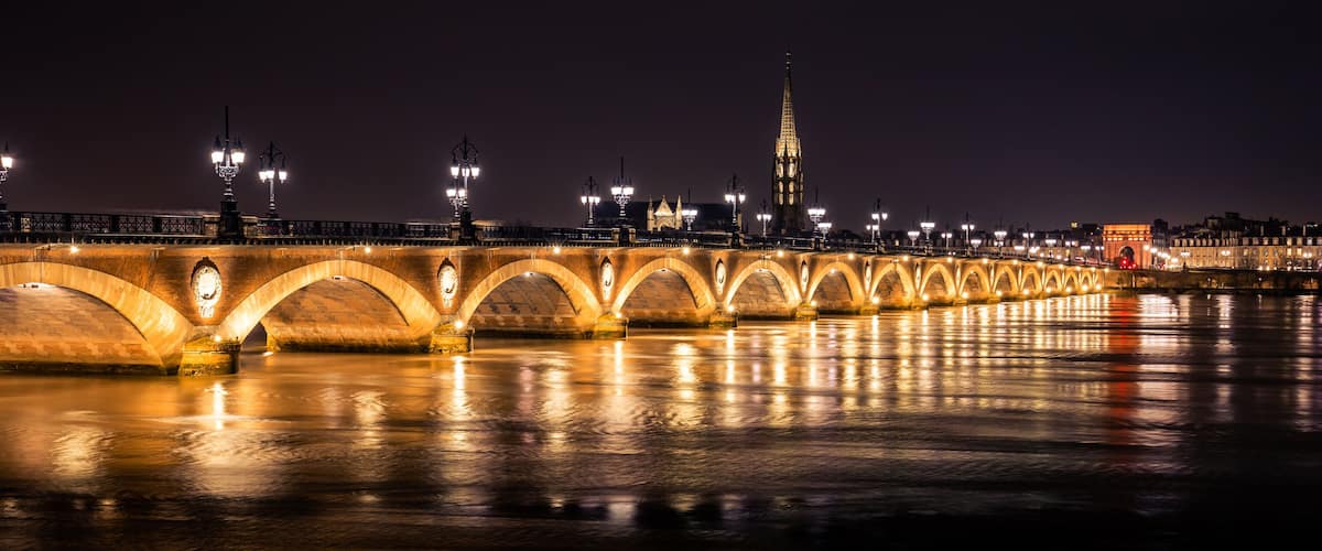 Bordeaux skyline at night with the Pont de Pierre bridge and the Garonne river