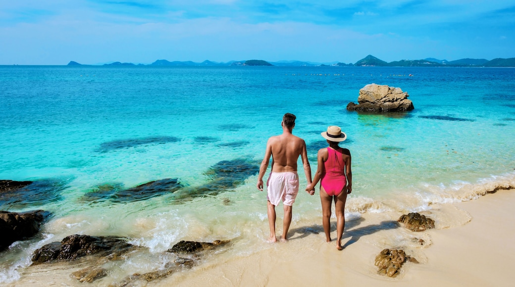 A couple of men and woman at Ko Kham tropical Island Sattahip Chonburi Samaesan Thailand