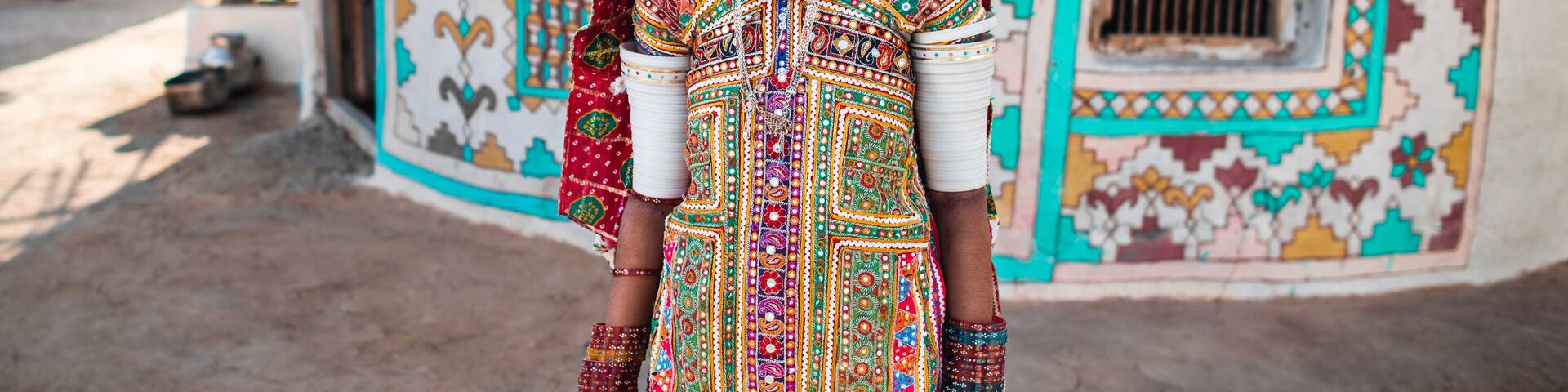 Ethnic Woman Near Traditional House