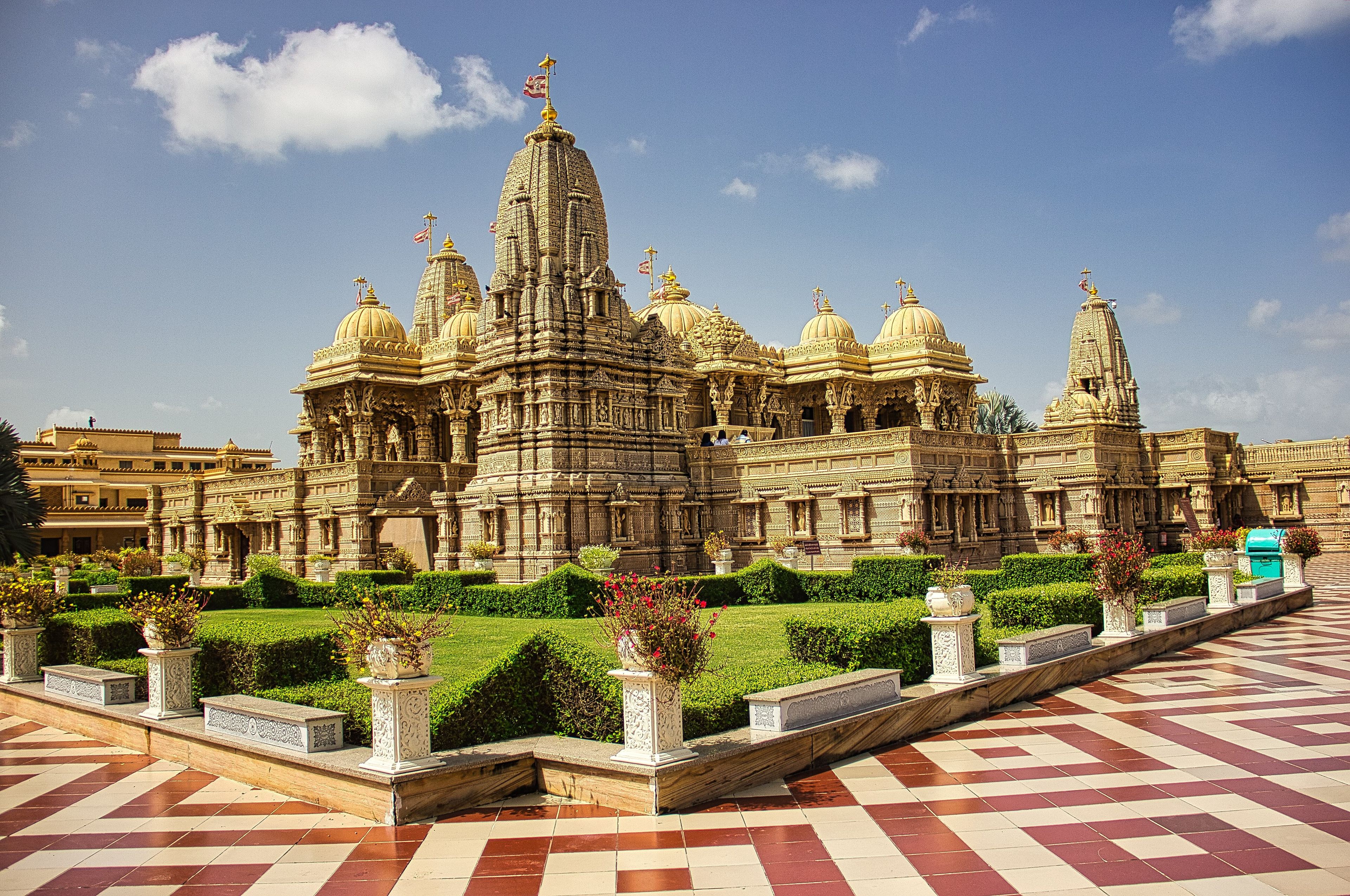 A large, ornate temple with multiple domes and intricate carvings.