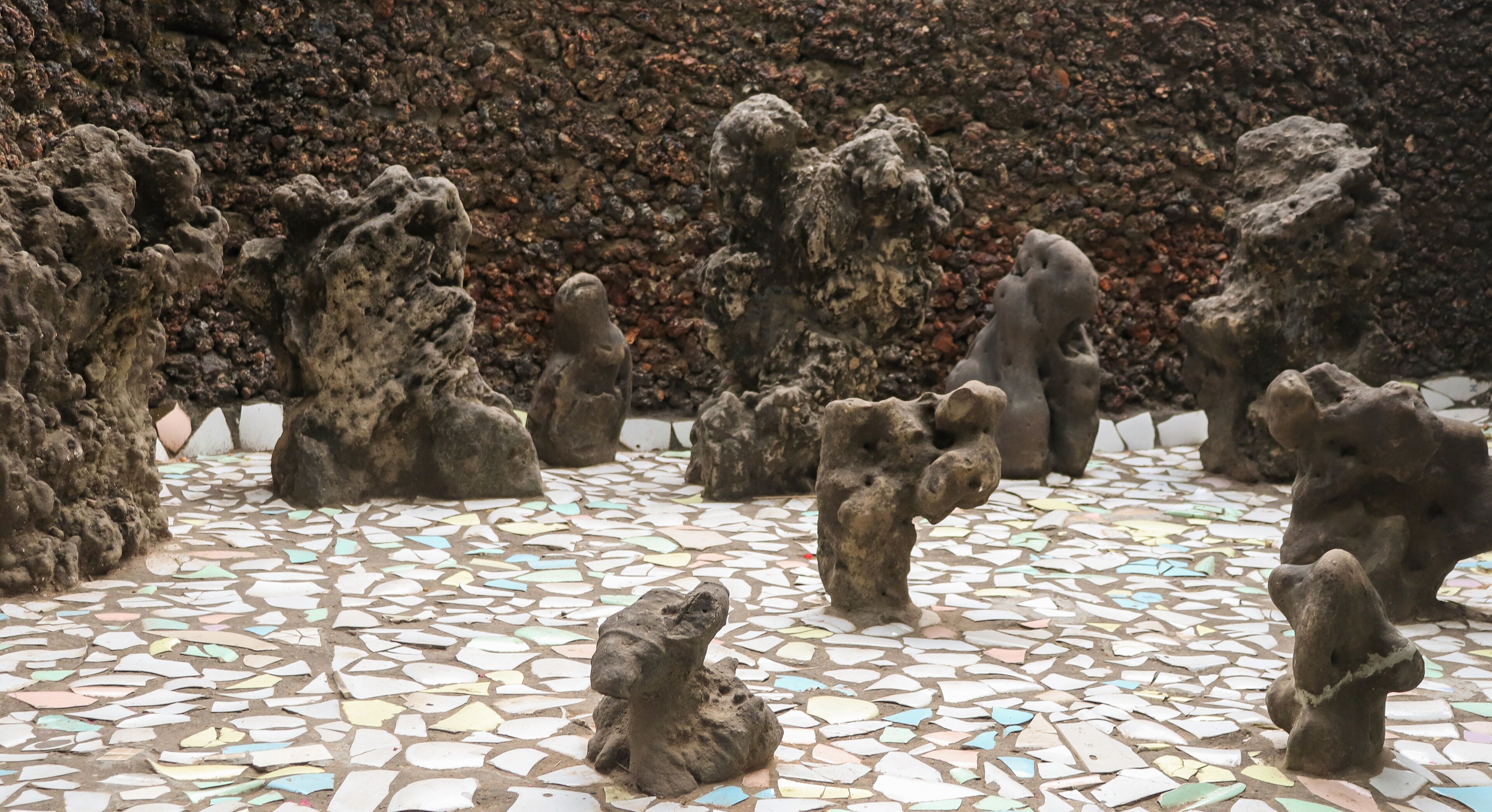 A mosaic floor with stone sculptures.