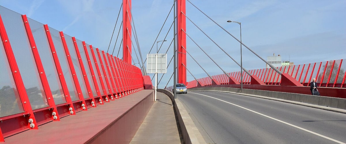 A red bridge with a clear sky.