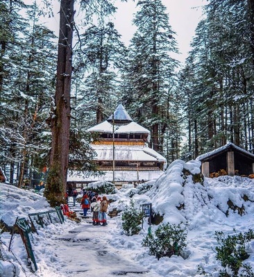 Located amidst the snow-covered hills of Manali, the Hadimba Temple is a unique shrine dedicated to Hidimba Devi, who was the wife of Bhima and mother of Ghatothkach. Surrounded by gorgeous cedar forests, this beautiful shrine is built on a rock which is believed to be in the image of goddess Hidimba herself. The construction style of the Hidimba Devi temple is entirely different from that of any of the other temples, with its wooden doorways, walls, and cone-shaped roof. This temple is a fitting dedication to its presiding deity Hadimba.
The magnificent Hidimba Devi Temple holds monumental importance to Hindu pilgrims as it is a part of the Hindu epic Mahabharata. Even apart from that, the Hadimba Temple is no less of wonder to nature lovers. Packed away into the laps of nature, this temple offers a quiet getaway to nature and peace lovers. Being quite a quaint story in itself, the Hidimba Temple is slowly but steadily attracting tourists from all over the country to its doors where history and heritage meet natural beauty.