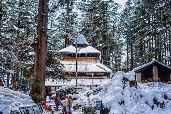 Located amidst the snow-covered hills of Manali, the Hadimba Temple is a unique shrine dedicated to Hidimba Devi, who was the wife of Bhima and mother of Ghatothkach. Surrounded by gorgeous cedar forests, this beautiful shrine is built on a rock which is believed to be in the image of goddess Hidimba herself. The construction style of the Hidimba Devi temple is entirely different from that of any of the other temples, with its wooden doorways, walls, and cone-shaped roof. This temple is a fitting dedication to its presiding deity Hadimba.
The magnificent Hidimba Devi Temple holds monumental importance to Hindu pilgrims as it is a part of the Hindu epic Mahabharata. Even apart from that, the Hadimba Temple is no less of wonder to nature lovers. Packed away into the laps of nature, this temple offers a quiet getaway to nature and peace lovers. Being quite a quaint story in itself, the Hidimba Temple is slowly but steadily attracting tourists from all over the country to its doors where history and heritage meet natural beauty.