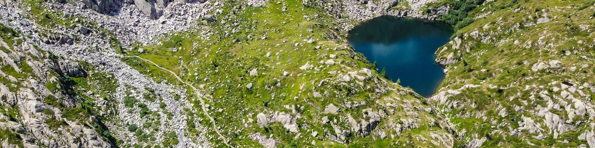Aerial view of Denza refuge and the alpine Denza lake (Presanella lake) in the Adamello - Presanella group, Vermiglio in Trentino Alto Adige, northern Italy, Europe. Italian alps