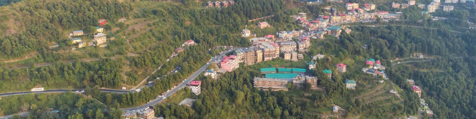 Aerial view of shoghi small suburban town in the district of solan about 15 kilometers from shimla along the famous kalka-shimla railway and national highway in himachal pradesh India.