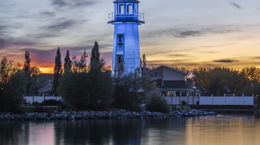 Vertical shot of a blue lighthouse near the shore of Sylvan Lake in Alberta, Canada