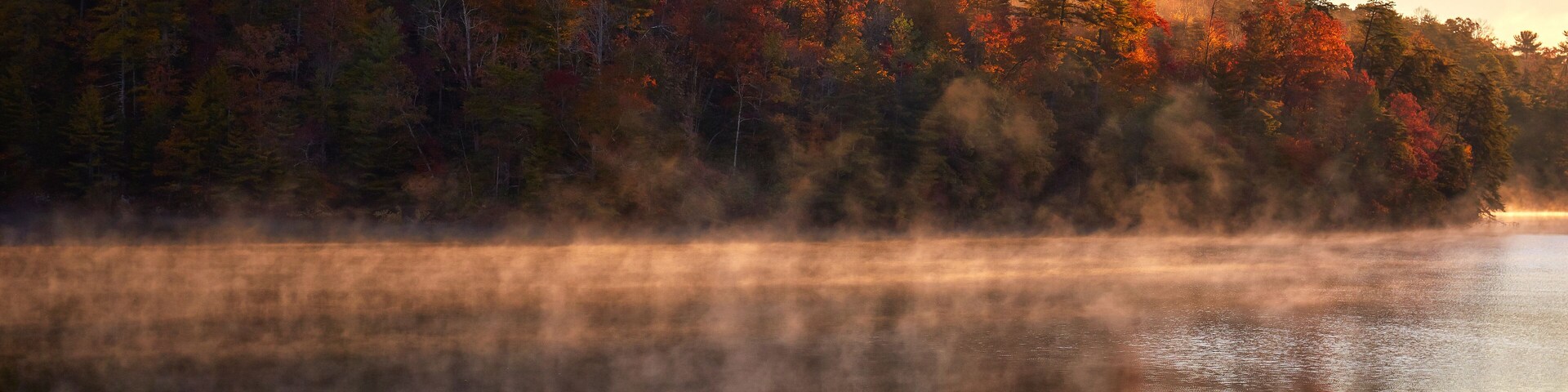 Early morning autumn reflection at Philpott Lake, located in the foothills of the Blue Ridge mountains near Stuart, Virginia