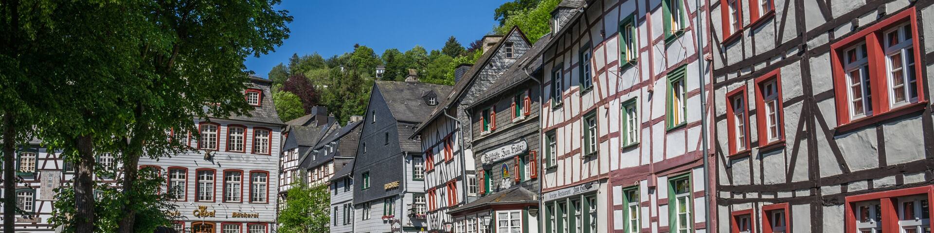 Monschau town in Germany street view with half-timbered houses and Rur river - a small resort town in the Eifel region of western Germany, located in the Aachen district of North Rhine-Westphalia
