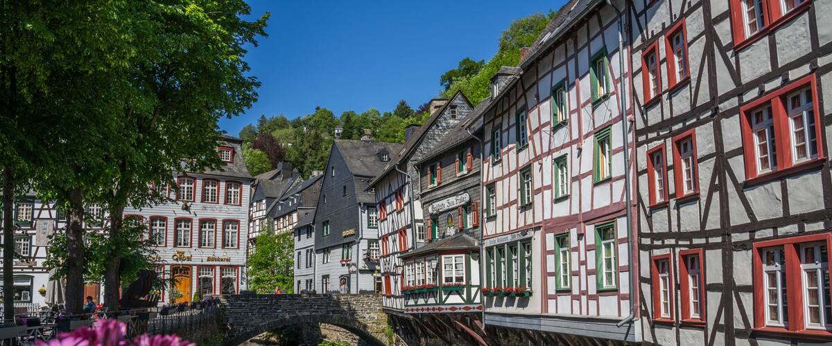 Monschau town in Germany street view with half-timbered houses and Rur river - a small resort town in the Eifel region of western Germany, located in the Aachen district of North Rhine-Westphalia