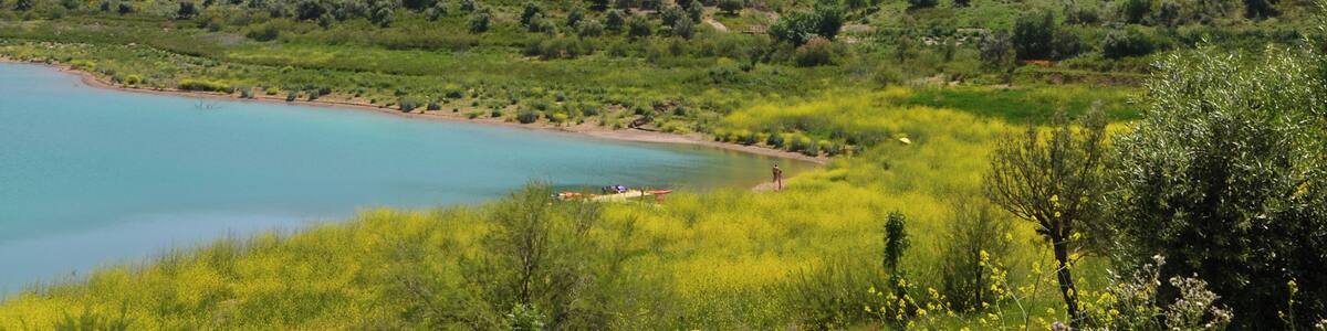 Zahara de la Sierra (Andalusia, Spain) photographed from the shore of Zahara-El Gastor reservoir.