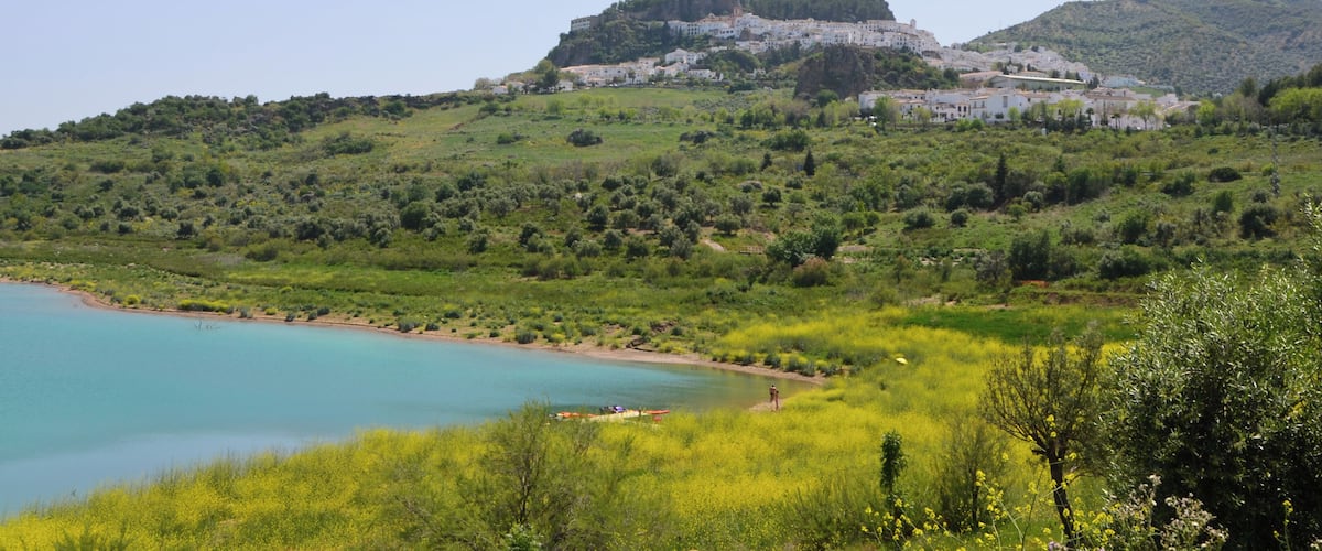 Zahara de la Sierra (Andalusia, Spain) photographed from the shore of Zahara-El Gastor reservoir.