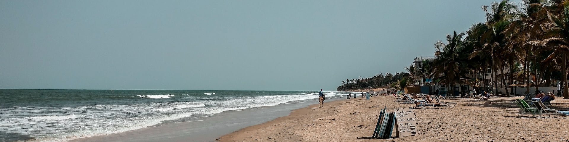 African surf board rent. Surf boards for rent at the beach. Kotu, The Gambia