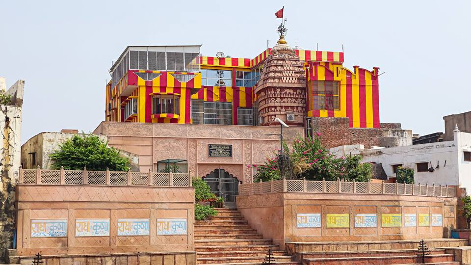 A colorful building with a sign reading "Radharani Hall".