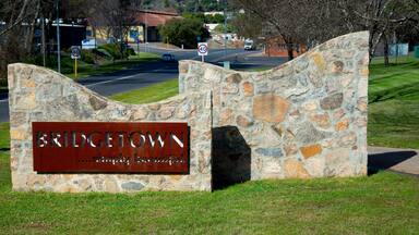A stone wall with a sign reading 'BRIDGETOWN Simply Beautiful.'