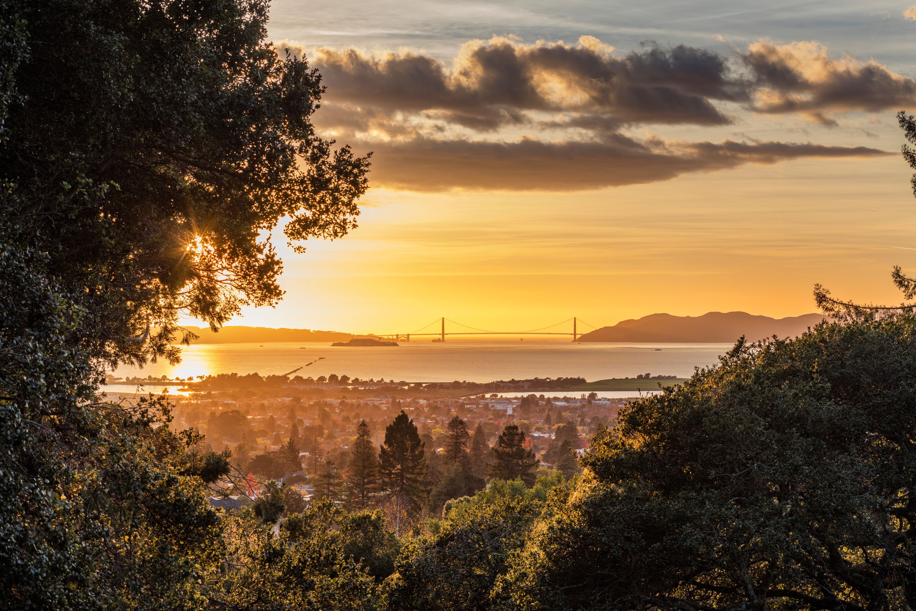 Panorama Golden Glow Sunset of San Francisco Bay looking over East Bay Berkeley