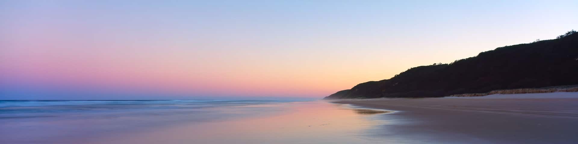 A panoramic view of sunset on Fraser Island's 75 mile beach