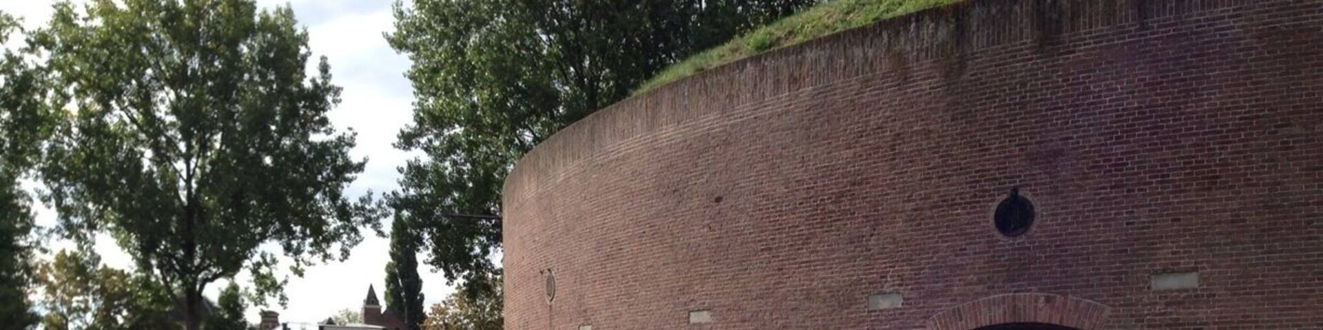 When you are interested in military history, the fortresses of the defense line of Amsterdam are a must see. Build around 1900, it consists of some 46 fortresseses, batteries, dikes, dams and locks. The enemy was partly kept out by inundating the land outside the defense line. The invention of the airplane was a real spoiler for military strategists...
Note: this fortress, Bastion de Bakkerschans, is not open to the public, but many other fortresses are. http://www.stellingvanamsterdam.nl/en/home