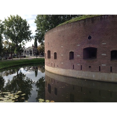 When you are interested in military history, the fortresses of the defense line of Amsterdam are a must see.  Build around 1900, it consists of some 46 fortresseses, batteries, dikes, dams and locks. The enemy was partly kept out by inundating the land outside the defense line. The invention of the airplane was a real spoiler for military strategists... 
Note: this fortress, Bastion de Bakkerschans, is not open to the public, but many other fortresses are. http://www.stellingvanamsterdam.nl/en/home