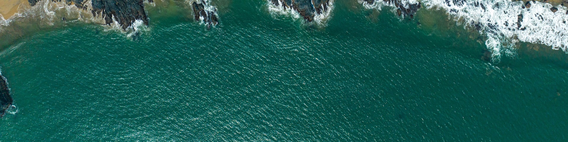 drone shot of blue water beach in maharashtra