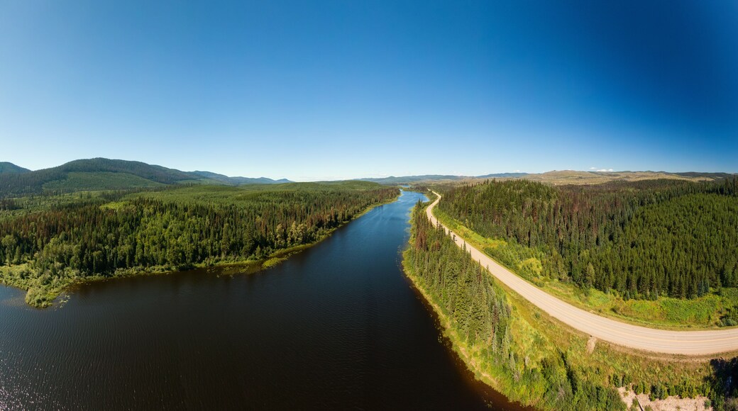 Scenic Panoramic Lake View of Curvy Road in Canadian Nature on a Sunny Summer Day. North of Prince George, John-Hart Highway, British Columbia.