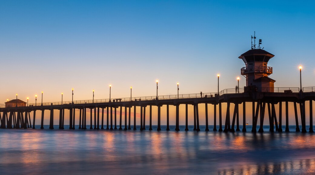 The Huntington Beach Pier in Huntington Beach at twilight sunset glow